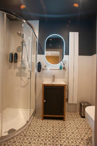 a bathroom with a shower and a sink at Causeway Squarings in Bushmills