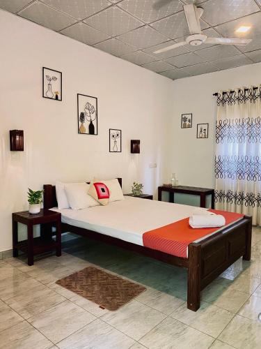 a bedroom with a large bed in a room at Yala Southern Retreat in Tissamaharama