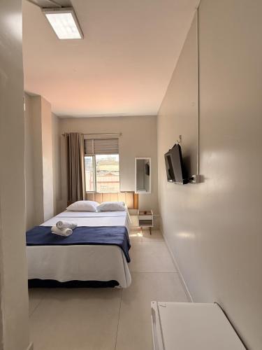 Cama ou camas em um quarto em Sky Hotel Ltda