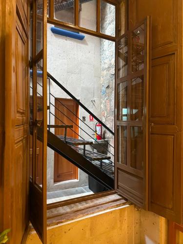 an open door with a view of a staircase at Casa Serdán, Suites & Events in Morelia
