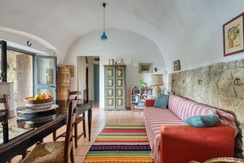 a living room with a couch and a table at Borgo Rinascimento in Farnese
