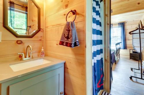 a bathroom with a sink and a mirror at Fire Pit, Gas Grill! Bright Cottage By Devils Lake in Manitou Beach