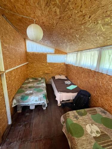 a small room with two beds in a tent at Snoveli Kazbegi Stepantsminda in Sno