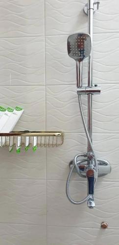 a shower head on a wall in a bathroom at Kilimanjaro pazuri summit villas 1 in Msaranga