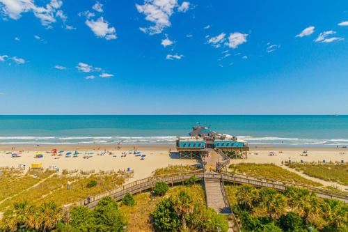 a view of a beach with people on the sand at Oceanfront 1BR by Skywheel Yachtsman 701 in Myrtle Beach