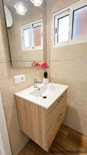 a bathroom with a sink and a mirror at Villa Soñada Setenil in Setenil