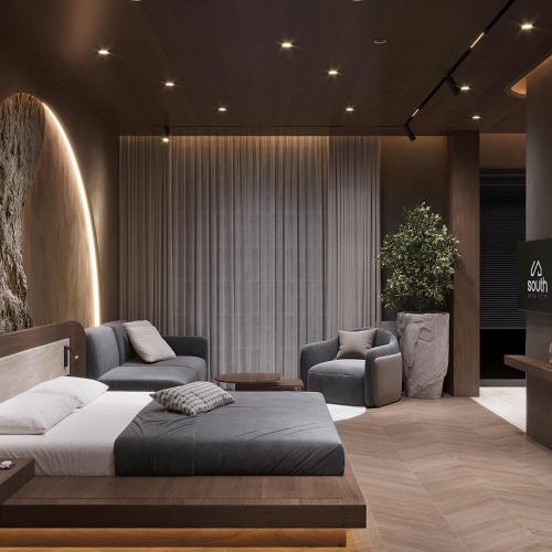 a bedroom with a bed and a couch and chairs at Boutique Hotel by Ruci in Terihat