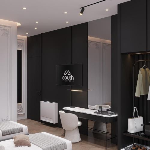 a bedroom with black walls and a table and a chair at Boutique Hotel by Ruci in Terihat