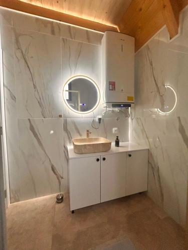 a bathroom with a sink and a mirror at Stress Away in Zlatibor