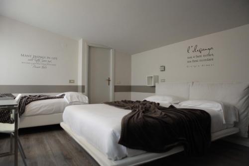 Postel nebo postele na pokoji v ubytování Albergo Al Cacciatore Tortellinando