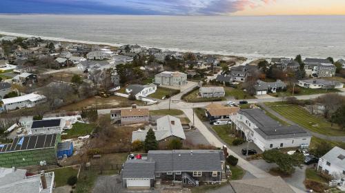 an aerial view of a residential neighborhood with the ocean at Gulls Nest in Gloucester