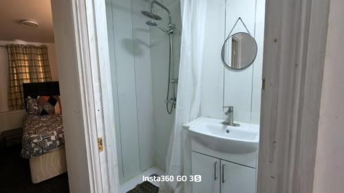 a bathroom with a shower and a sink at Abysplace SM in Kenton