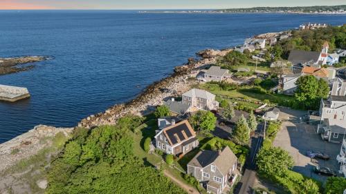 an aerial view of a house by the water at The Rockporter in Rockport