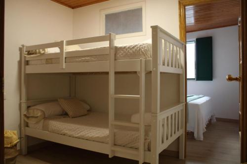 a couple of bunk beds in a room at La Divina 1 in Ribadavia