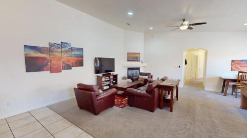a living room with a couch and a table at Leisure Space #327 in Moab