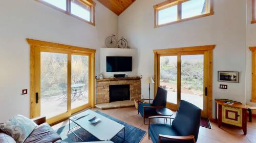 a living room with a couch and a fireplace at Rim View Retreat #14 in Moab
