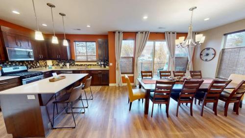 a kitchen and dining room with a table and chairs at Entrada at Moab #640 in Moab