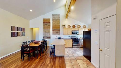 a kitchen and dining room with a table and chairs at Desert Hideaway #C2 in Moab