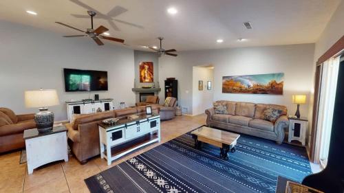 a large living room with couches and a table at Adventure Base Camp #381 in Moab