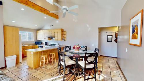 a kitchen and dining room with a table and chairs at Mountain Paradise #G3 in Moab