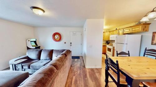 a living room with a couch and a table at Red Cliff Condos #1H in Moab