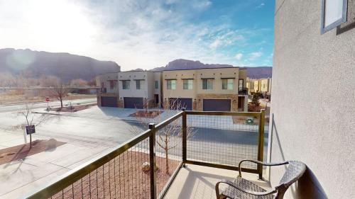 a balcony with a view of a tennis court at Entrada at Moab #430 in Moab