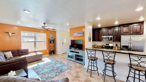 a kitchen and living room with a couch and a table at Slick Rock Reserve #12A3 in Moab