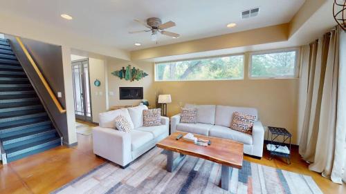 a living room with a couch and a table at Millcreek on Main in Moab
