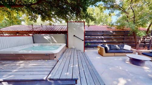 a hot tub sitting on top of a wooden deck at Moab Flats #6 in Moab