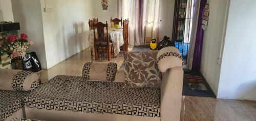 a living room with a couch with pillows at Bethany in Rivière Dragon