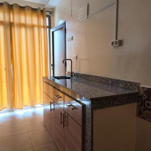 a kitchen with a sink and a counter top at Soul Surf House in Agadir
