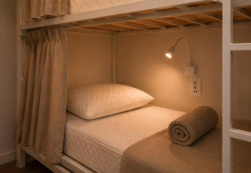 a bedroom with a bunk bed with aermott at Lulle Hostel - Congonhas - Expo - Interlagos - Morumbi in São Paulo