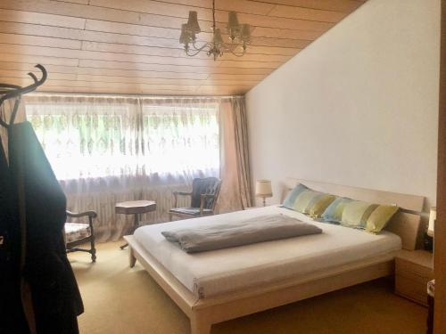 a bedroom with a bed in front of a window at Only Lady Kaarst in Kaarst