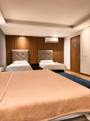 a hospital room with two beds in it at hotel 202 in Monterrey