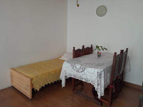 a room with a table and chairs with a table and a tableablish at Villarrica in Valle Hermoso