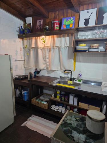 a kitchen with a sink and a counter top at El Refugio Misiones in Garupá