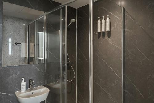 a bathroom with a shower and a sink at Four Points Flex by Sheraton Edinburgh in Edinburgh