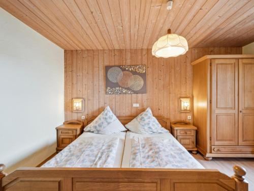 a bedroom with a bed with a wooden ceiling at Traudi in Waldkirchen