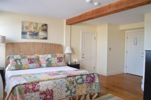 a bedroom with a king sized bed in a room at Newagen Seaside Inn in Southport