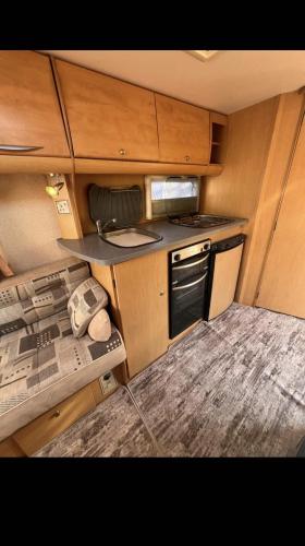 an interior view of a kitchen in an rv at Кемпер дом in Chişinău