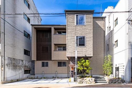an exterior view of an apartment building at GRAND BASE Peace Park in Nagasaki