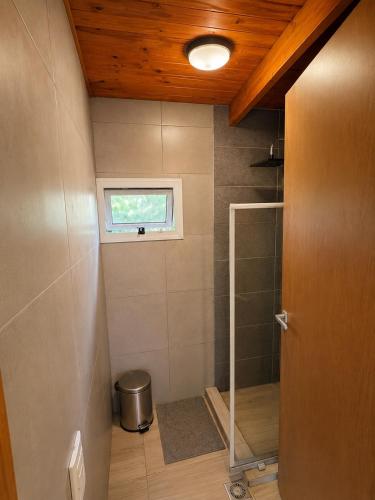 a small bathroom with a shower and a window at Complejo La Cascada San Javier in San Javier