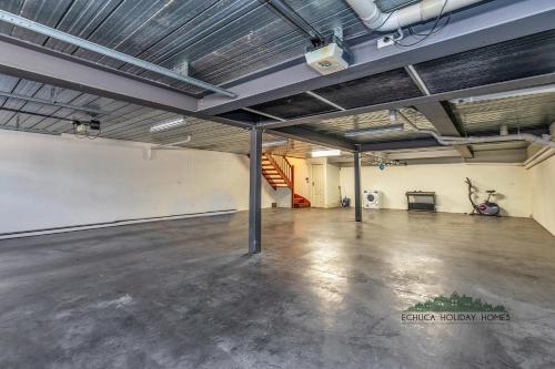 an empty parking lot with a staircase in a garage at Llewoh on Crofton in Echuca