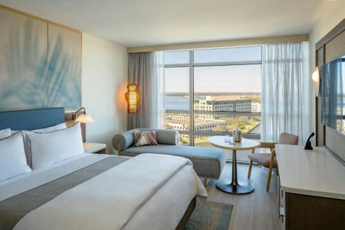 a hotel room with a bed and a large window at The Westin Tampa Bay in Tampa