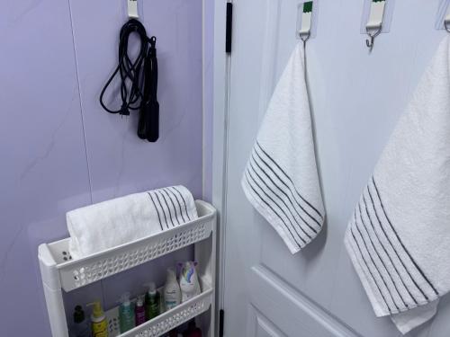 a bathroom with a towel hanging on a wall at Mongolian traditional house Ger in Dzuunmod