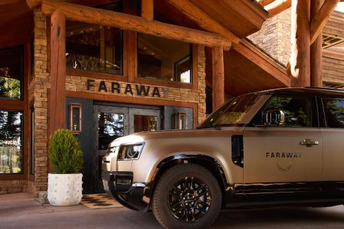 a white jeep parked in front of a store at Faraway Jackson Hole in Teton Village