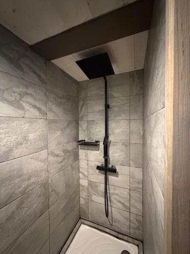a shower in a bathroom with a shower at Source Olympique Alpes in Gilly-sur-Isère