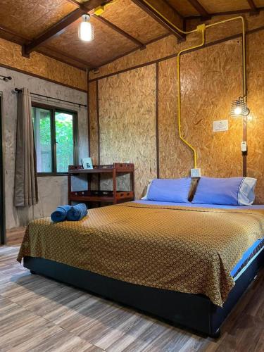a bedroom with a large bed in a room at Lok Mun Bungalows in Ko Yao Noi