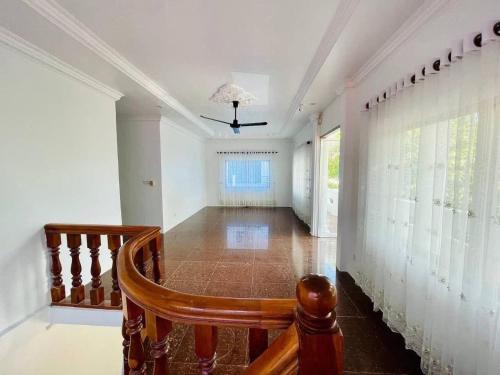 a hallway of a home with a wooden staircase at Peace And Cool Hotel in Siem Reap