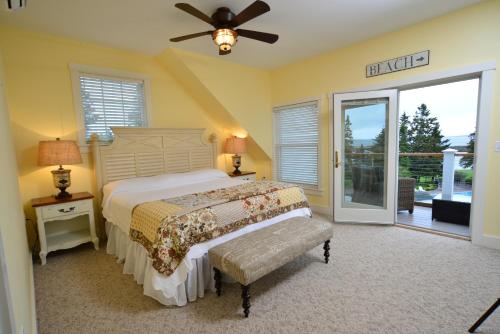 a bedroom with a bed and a ceiling fan at Newagen Seaside Inn in Southport